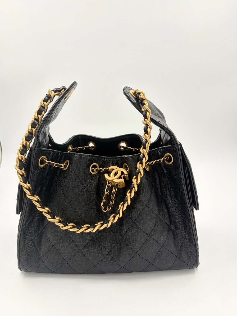 CHANEL Black Quilted Drawstring Shoulder Bag with Gold Chain Detail